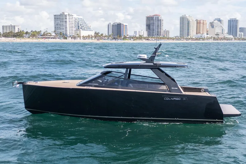 Slide: The Image of 2025 Colnago C38 OPEN yacht cruising near a city skyline. - 52