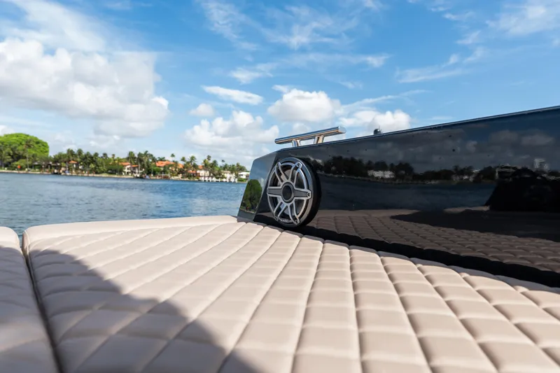 Slide: The Image of Luxurious Colnago C38 OPEN boat deck with speaker, 2025 model, on a sunny day by the water. - 57