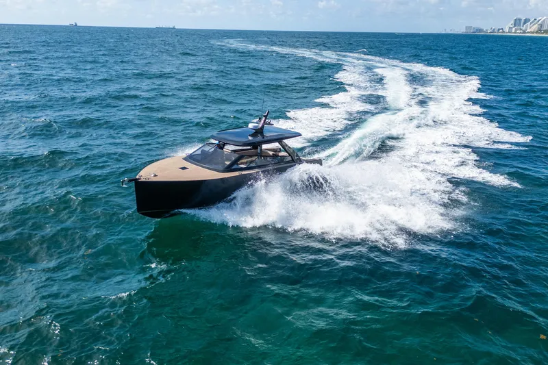 Slide: The Image of 2025 Colnago C38 OPEN yacht cruising on open sea, leaving a white wake. - 6