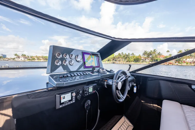 Slide: The Image of Helm of 2025 Colnago C38 OPEN yacht with navigation system and scenic water view. - 63