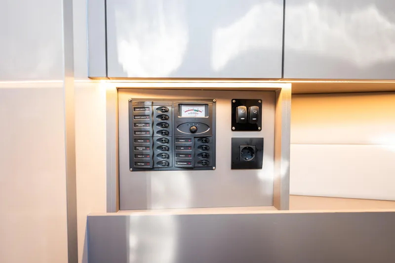 Slide: The Image of Control panel with switches and socket in a modern Colnago C38 OPEN, 2025 model. - 72