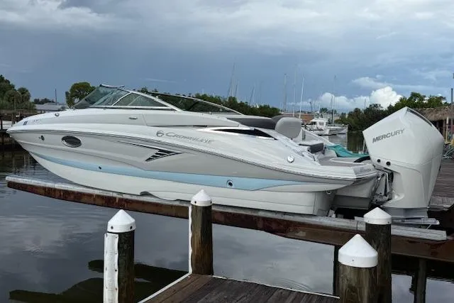 Slide: The Image of 2021 Crownline Eclipse E235 XS boat docked with Mercury engine. - 0