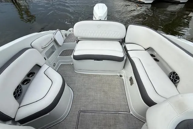Slide: The Image of Interior of 2021 Crownline Eclipse E235 XS boat with plush seating and cup holders. - 4