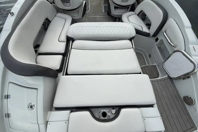Slide: The Image of 2021 Crownline Eclipse E235 XS boat interior with luxurious white seating and modern design. - 6