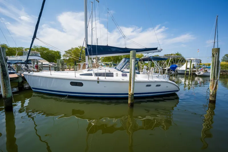 The Image of Sailboat docked in marina, 1999 Hunter 410 model, under clear blue sky. - 0