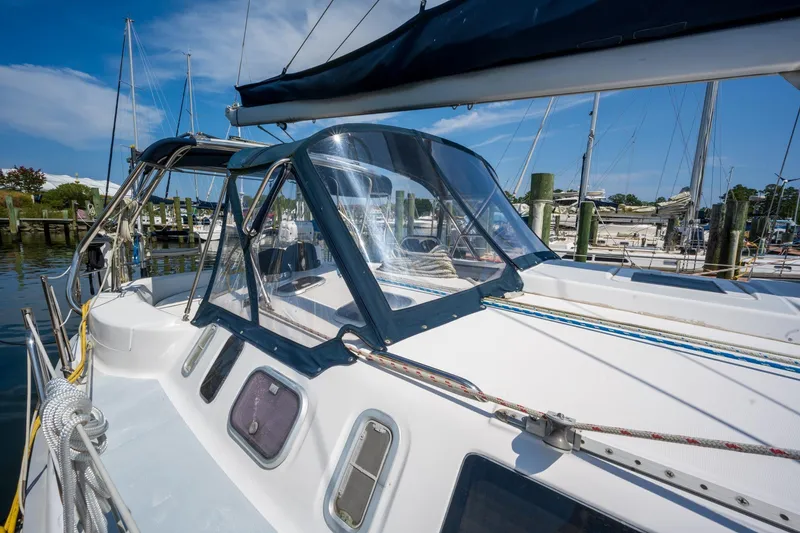 Slide: The Image of Sailboat Hunter 410, 1999 model, docked at marina with clear blue sky. - 2
