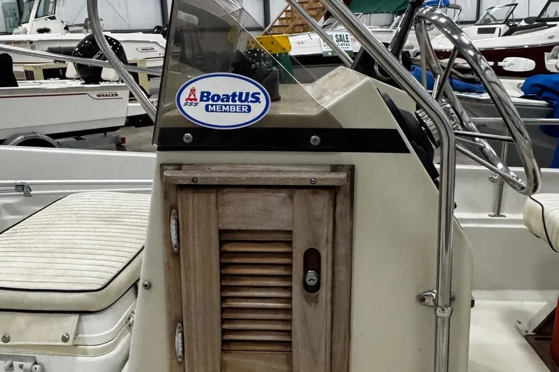 Slide: The Image of 1991 Boston Whaler 17 Montauk console with BoatUS member sticker in a showroom. - 12