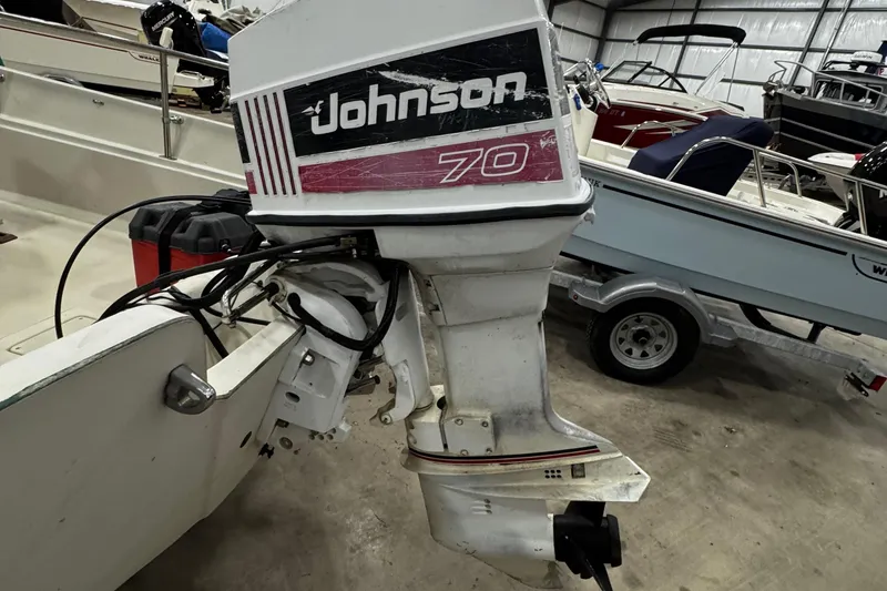 Slide: The Image of 1991 Boston Whaler 17 Montauk with Johnson 70 outboard motor in storage. - 17