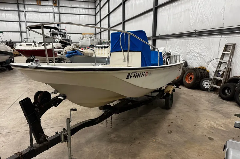 Slide: The Image of 1991 Boston Whaler 17 Montauk boat on trailer in storage facility. - 2