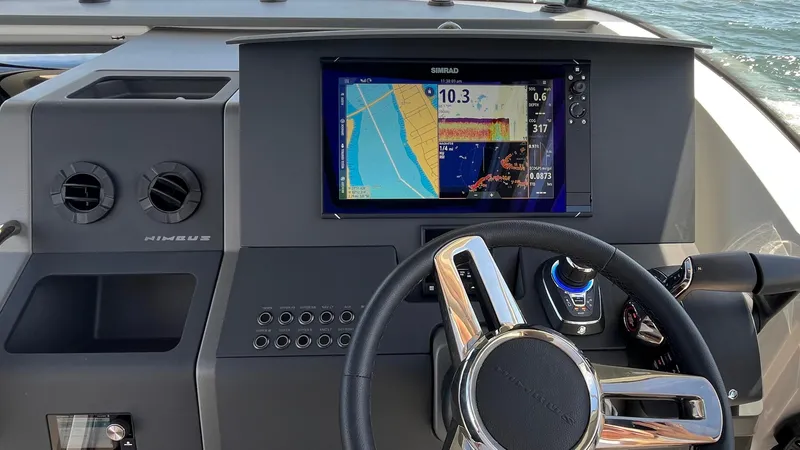 Slide: The Image of Dashboard of 2025 Nimbus Commuter 11 #086 with navigation display and steering wheel. - 31