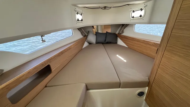Slide: The Image of Luxurious interior cabin of 2025 Nimbus Commuter 11, featuring cozy bedding and wooden accents. - 35
