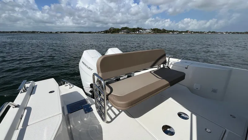 Slide: The Image of Nimbus Commuter 11 #086 boat, 2025 model, with seating, on a calm water body. - 10