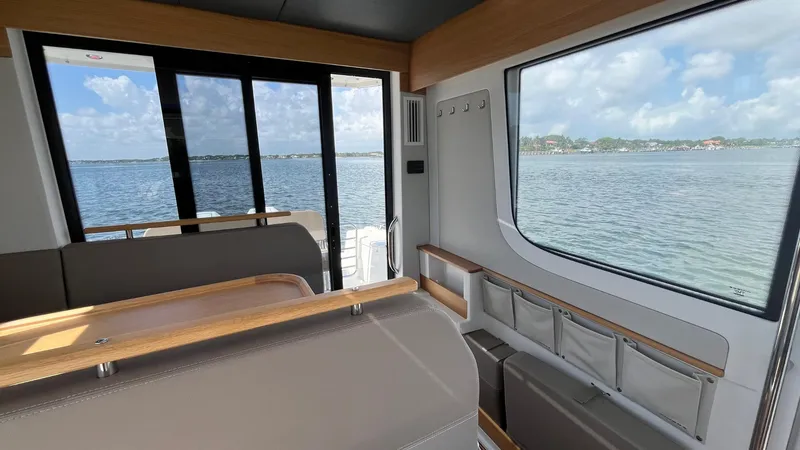 Slide: The Image of Interior view of Nimbus Commuter 11 #086, 2025 model, overlooking serene waters. - 17