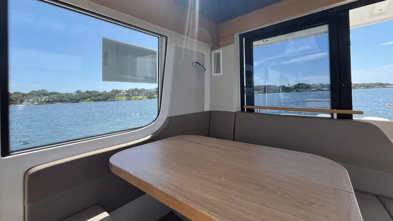 Slide: The Image of Interior of 2025 Nimbus Commuter 11 boat with scenic water view. - 20