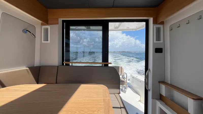 Slide: The Image of Interior view of 2025 Nimbus Commuter 11 #086 yacht with ocean backdrop. - 25