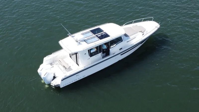 Slide: The Image of Aerial view of 2025 Nimbus Commuter 11 #086 boat on open water. - 5