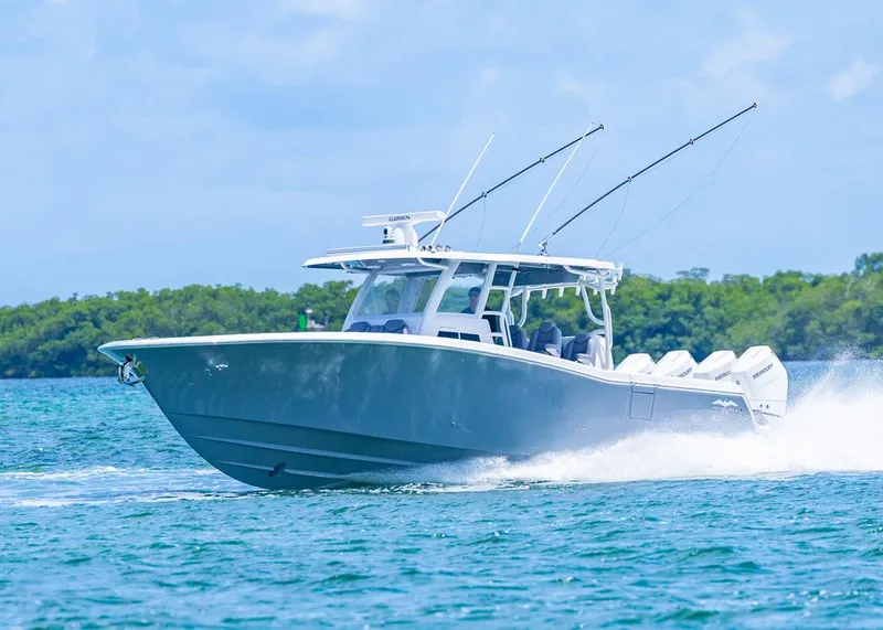 Slide: The Image of 2025 Invincible 43 Open Fisherman boat cruising on blue water. - 0