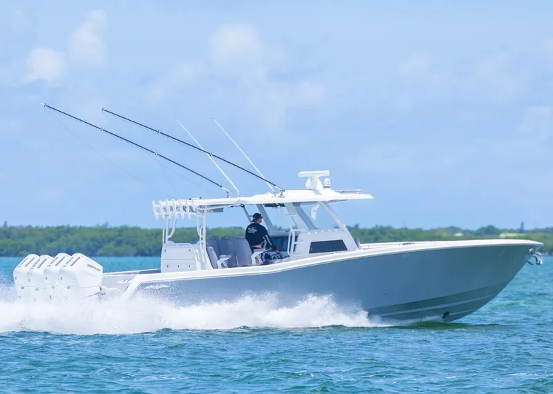 Slide: The Image of 2025 Invincible 43 Open Fisherman boat cruising on blue water. - 1