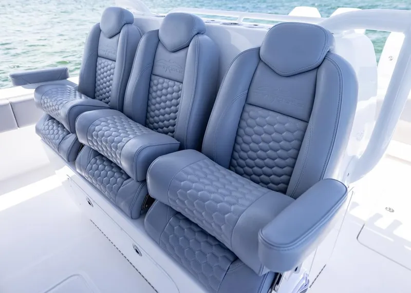 Slide: The Image of Luxurious seating on 2025 Invincible 43 Open Fisherman boat, featuring elegant blue upholstery. - 20