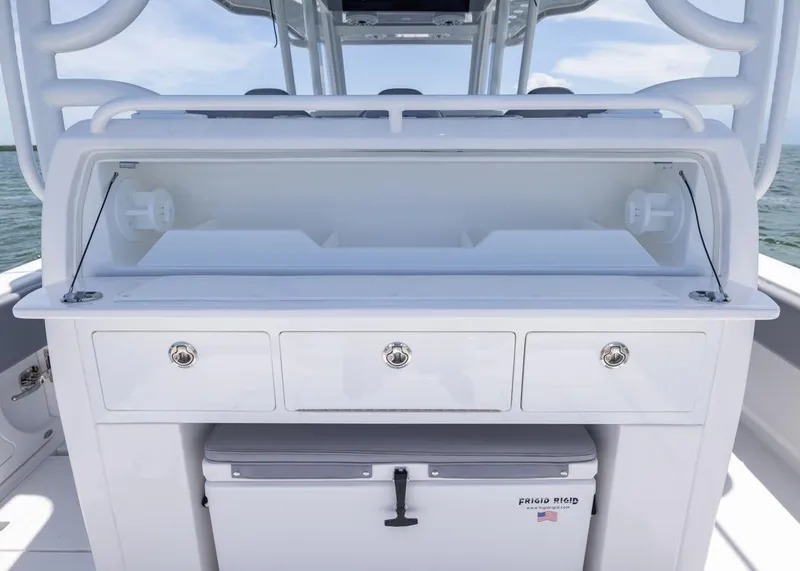 Slide: The Image of 2025 Invincible 43 Open Fisherman boat with storage compartments and cooler. - 23