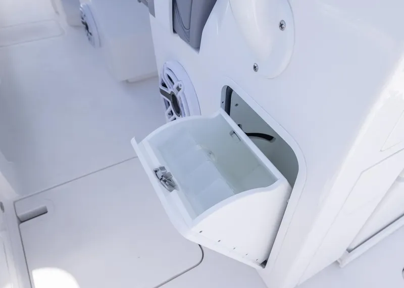 Slide: The Image of Open storage compartment on 2025 Invincible 43 Open Fisherman boat interior. - 24