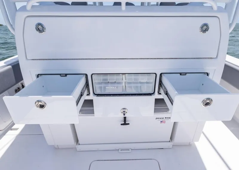 Slide: The Image of 2025 Invincible 43 Open Fisherman boat storage compartments with open drawers. - 27