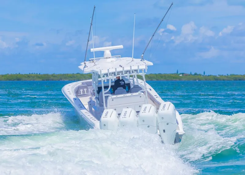 Slide: The Image of 2025 Invincible 43 Open Fisherman cruising on blue ocean waters. - 3