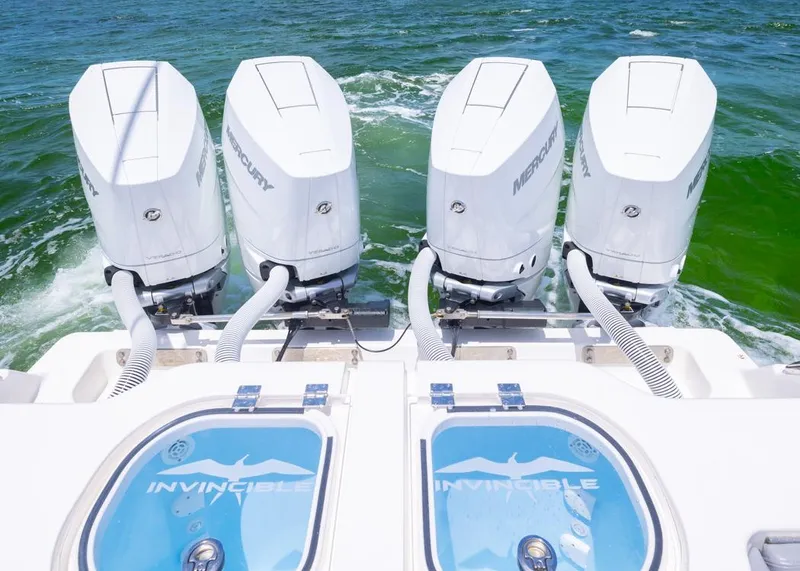 Slide: The Image of 2025 Invincible 43 Open Fisherman with four Mercury outboard engines on the ocean. - 32