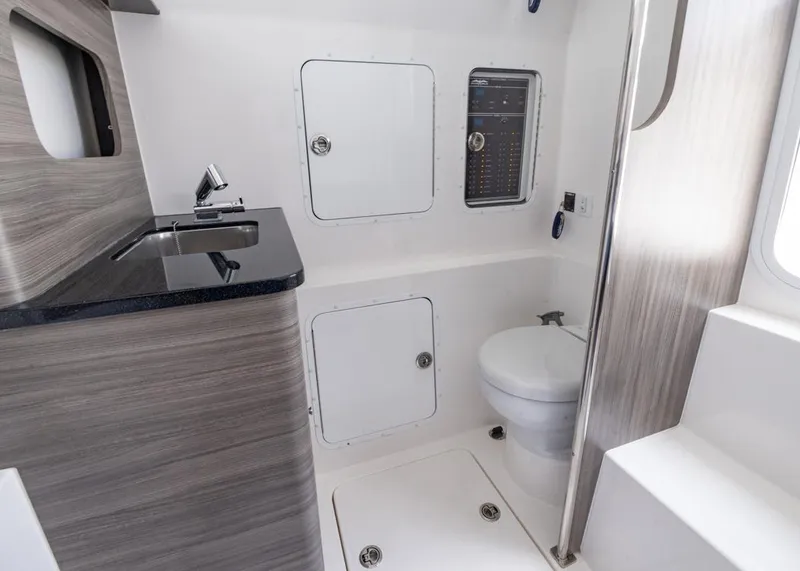 Slide: The Image of 2025 Invincible 43 Open Fisherman boat interior with modern bathroom amenities. - 39