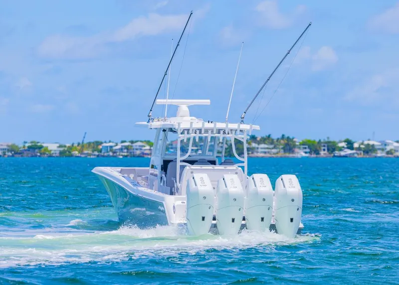 Slide: The Image of 2025 Invincible 43 Open Fisherman boat cruising on blue ocean waters. - 45