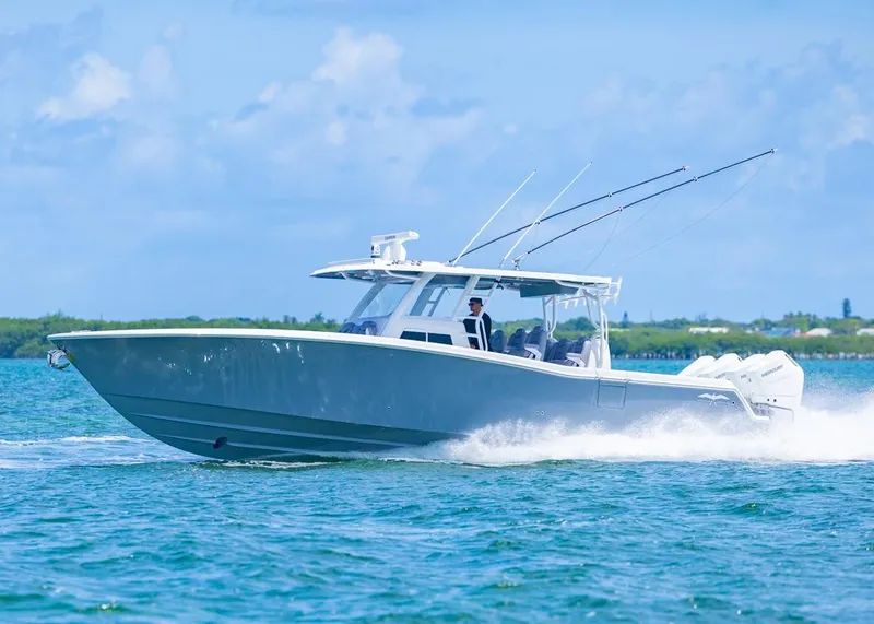 Slide: The Image of 2025 Invincible 43 Open Fisherman cruising on blue ocean waters. - 46