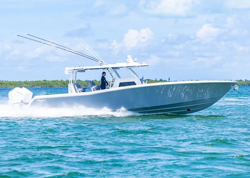 Slide: The Image of 2025 Invincible 43 Open Fisherman cruising on blue ocean waters. - 48