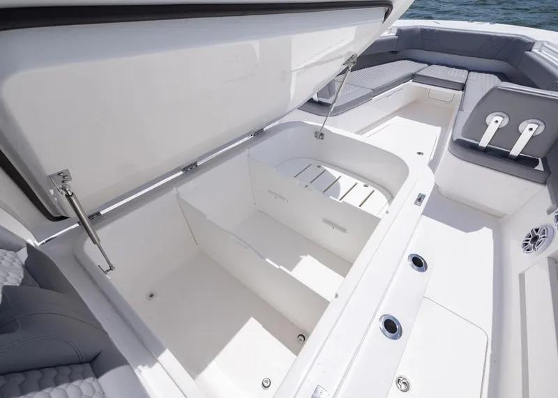Slide: The Image of 2025 Invincible 43 Open Fisherman boat with open storage compartment and seating area. - 7