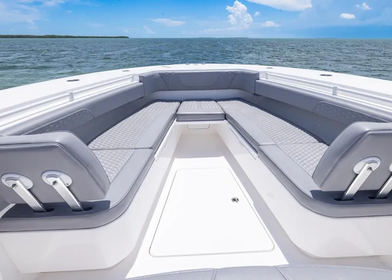 Slide: The Image of 2025 Invincible 43 Open Fisherman boat interior with luxurious seating and ocean view. - 8