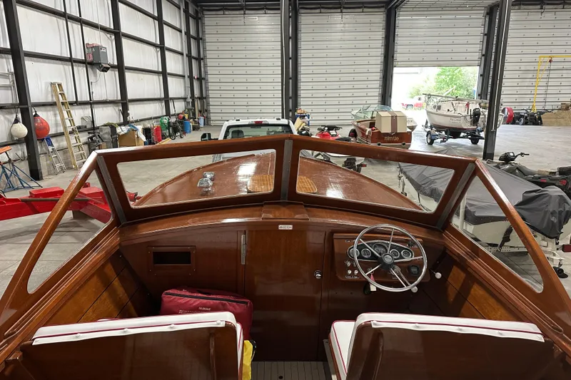 Slide: The Image of 1961 Lyman 21 Runabout boat interior in a spacious garage setting. - 12