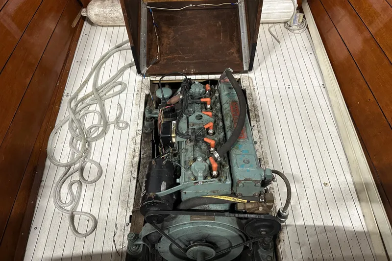 Slide: The Image of 1961 Lyman 21 Runabout engine compartment with visible ropes and wooden interior. - 19