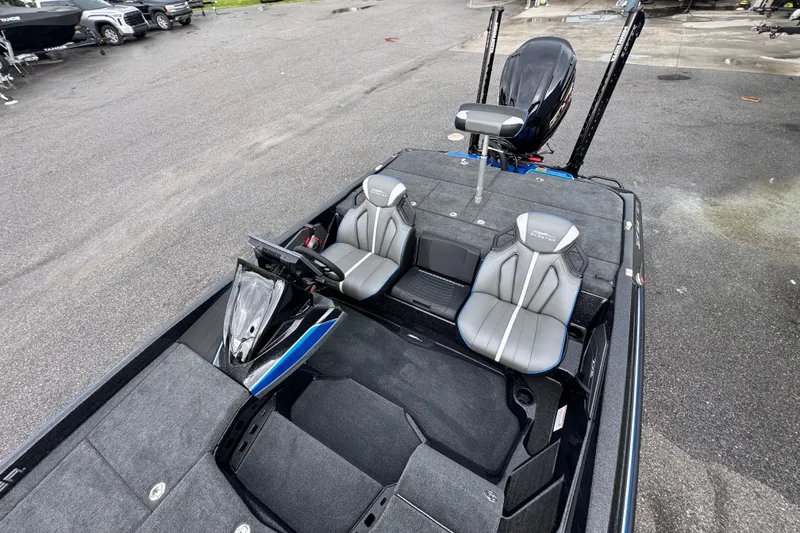 Slide: The Image of 2026 Skeeter ZXE20 boat interior with dual seats and steering console. - 13