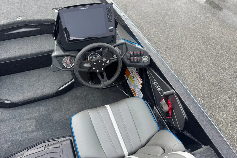 Slide: The Image of 2026 Skeeter ZXE20 boat cockpit with steering wheel and control panel. - 15
