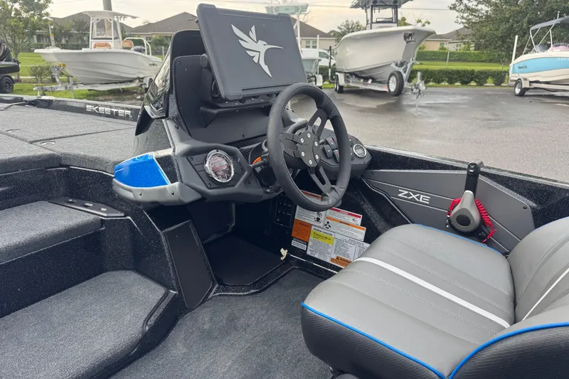 Slide: The Image of 2026 Skeeter ZXE20 boat cockpit with steering wheel and dashboard controls. - 17
