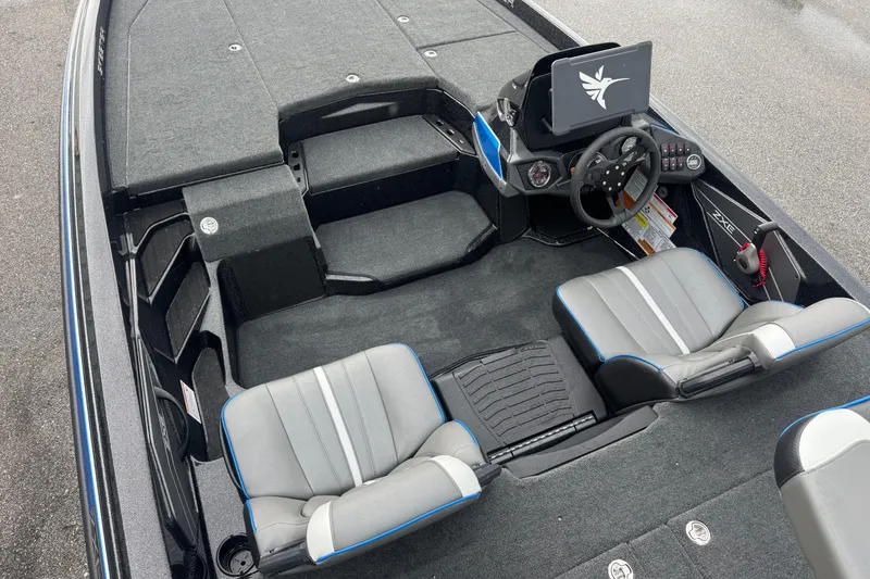 Slide: The Image of 2026 Skeeter ZXE20 boat interior with dual seats, steering wheel, and control panel. - 18