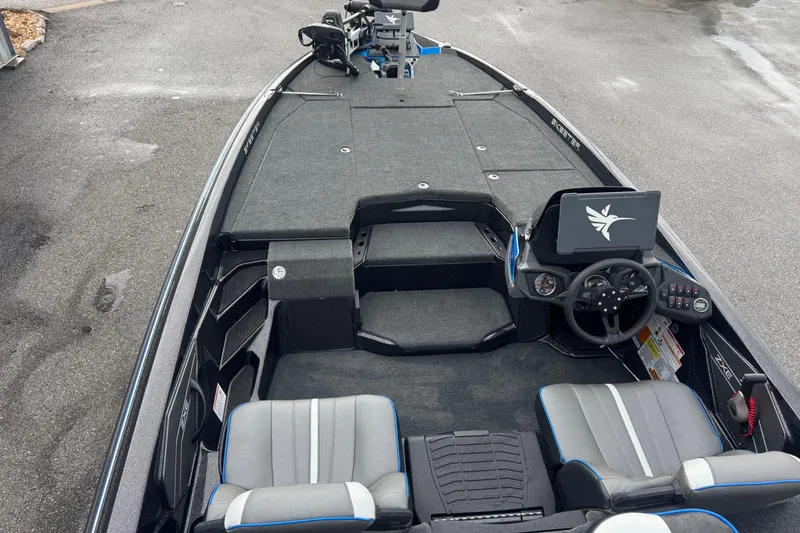 Slide: The Image of 2026 Skeeter ZXE20 boat interior with steering console and seating. - 19
