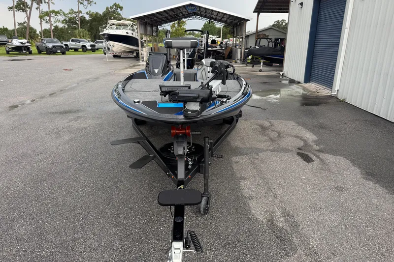 Slide: The Image of 2026 Skeeter ZXE20 boat on trailer in outdoor storage area. - 3