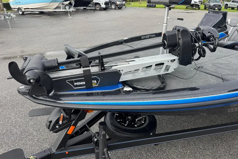 Slide: The Image of 2026 Skeeter ZXE20 boat with Minn Kota trolling motor on trailer. - 4