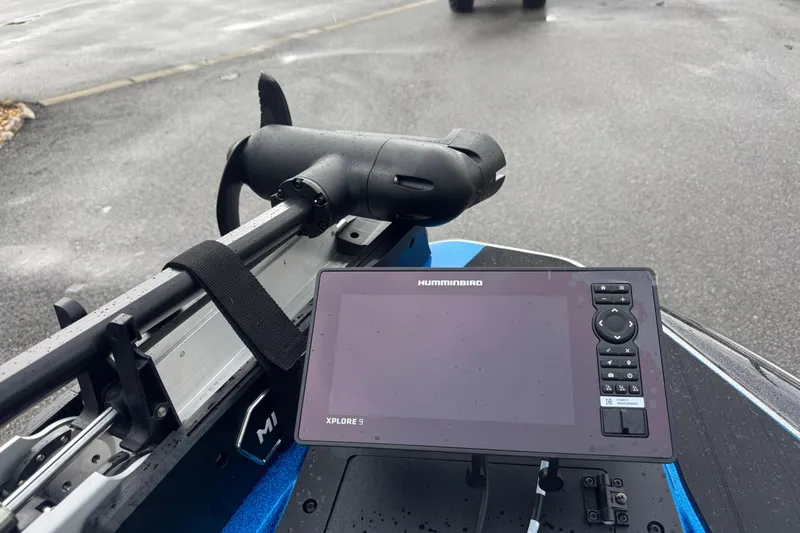 Slide: The Image of Skeeter ZXE20 boat with Humminbird Xplore 9 fish finder, 2026 model, on wet pavement. - 9