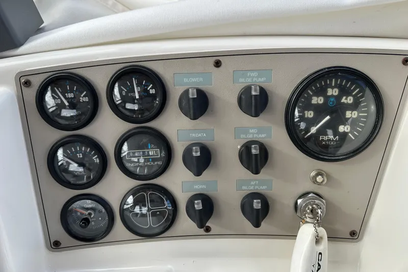 Slide: The Image of Control panel of a 1997 Carver 325 Motor Yacht with gauges and switches. - 15