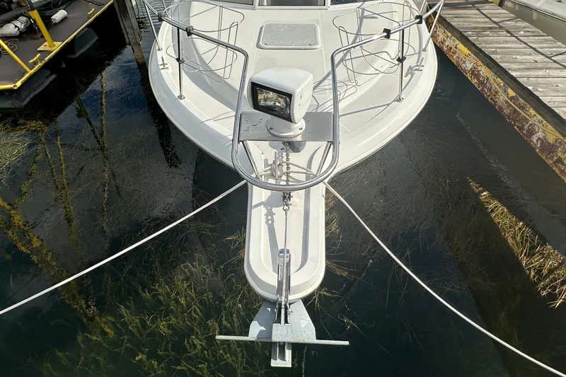 Slide: The Image of Bow view of 1997 Carver 325 Motor Yacht docked at marina. - 8