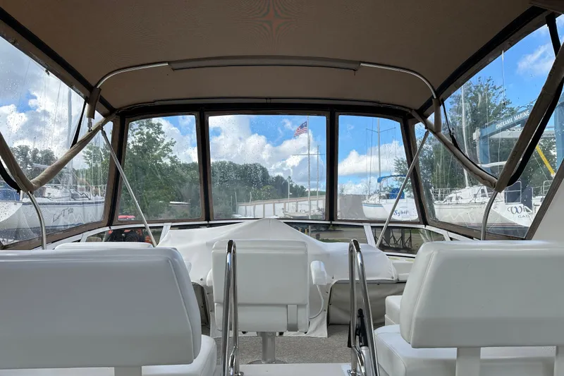Slide: The Image of Interior view of 1997 Carver 325 Motor Yacht with helm and seating. - 11