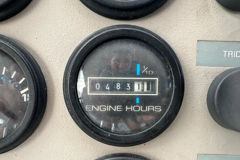 Slide: The Image of Close-up of Carver 325 Motor Yacht engine hours gauge, showing 483.1 hours. - 16