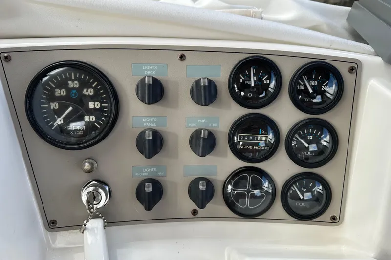 Slide: The Image of Control panel of a 1997 Carver 325 Motor Yacht with gauges and switches. - 18