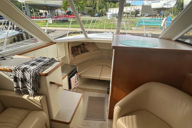 Slide: The Image of Interior of 1997 Carver 325 Motor Yacht with seating and kitchenette. - 24